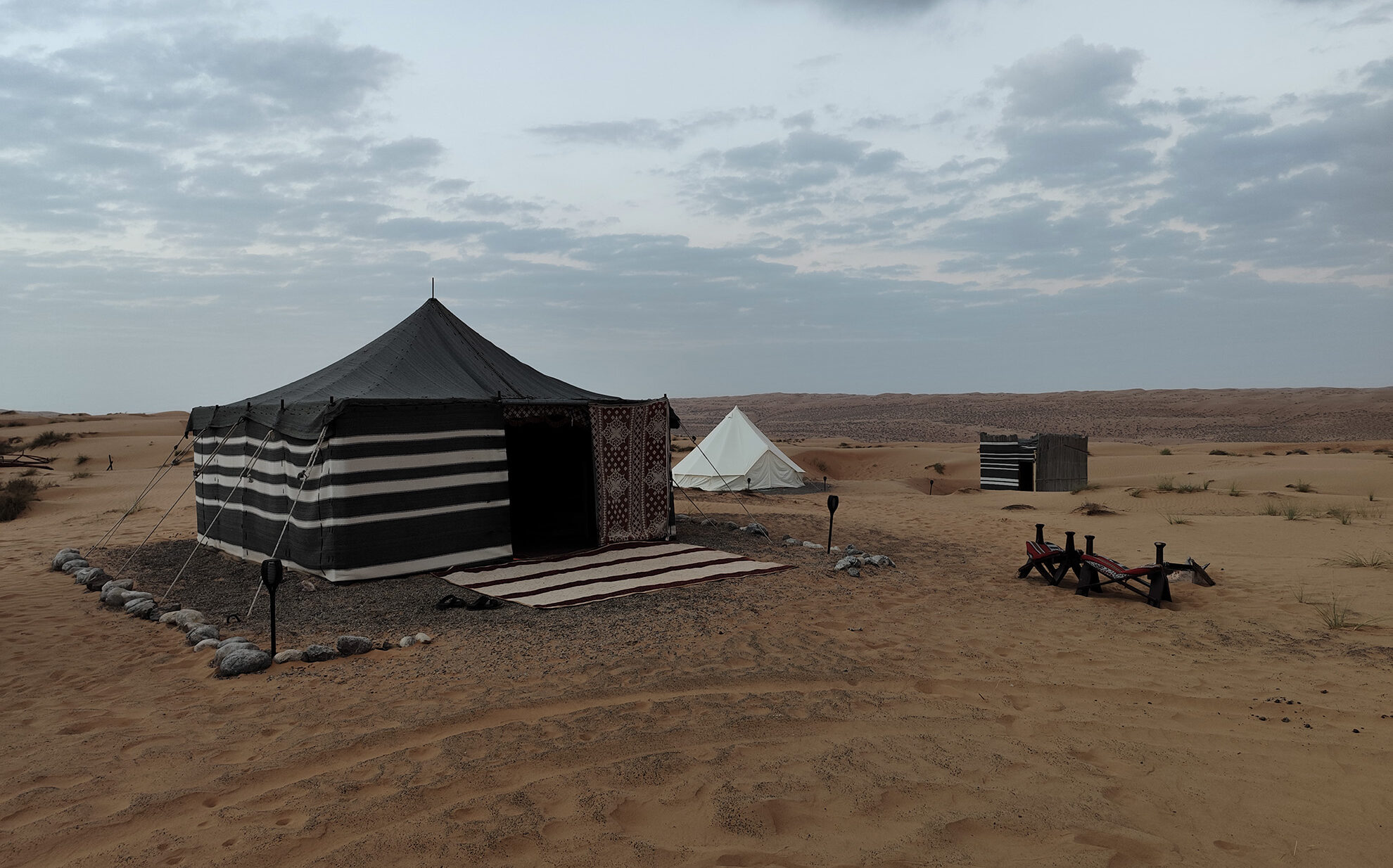 Private desert camp surrounded by dunes in Wahiba Sands Oman